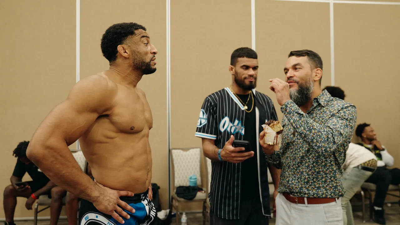 Julien Williams, a teammate and Mitchell Chamale in the back room with the retirement cheesecake