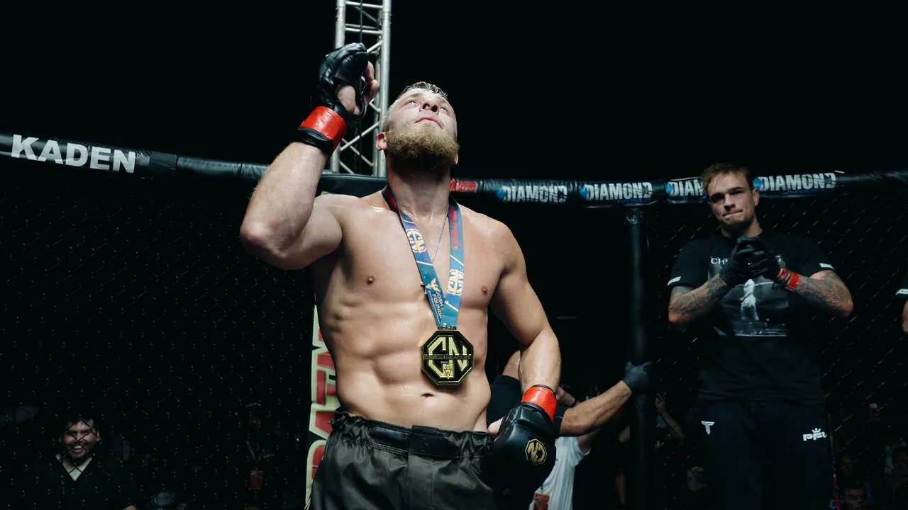 John Morea in the cage wearing the medal after the decision