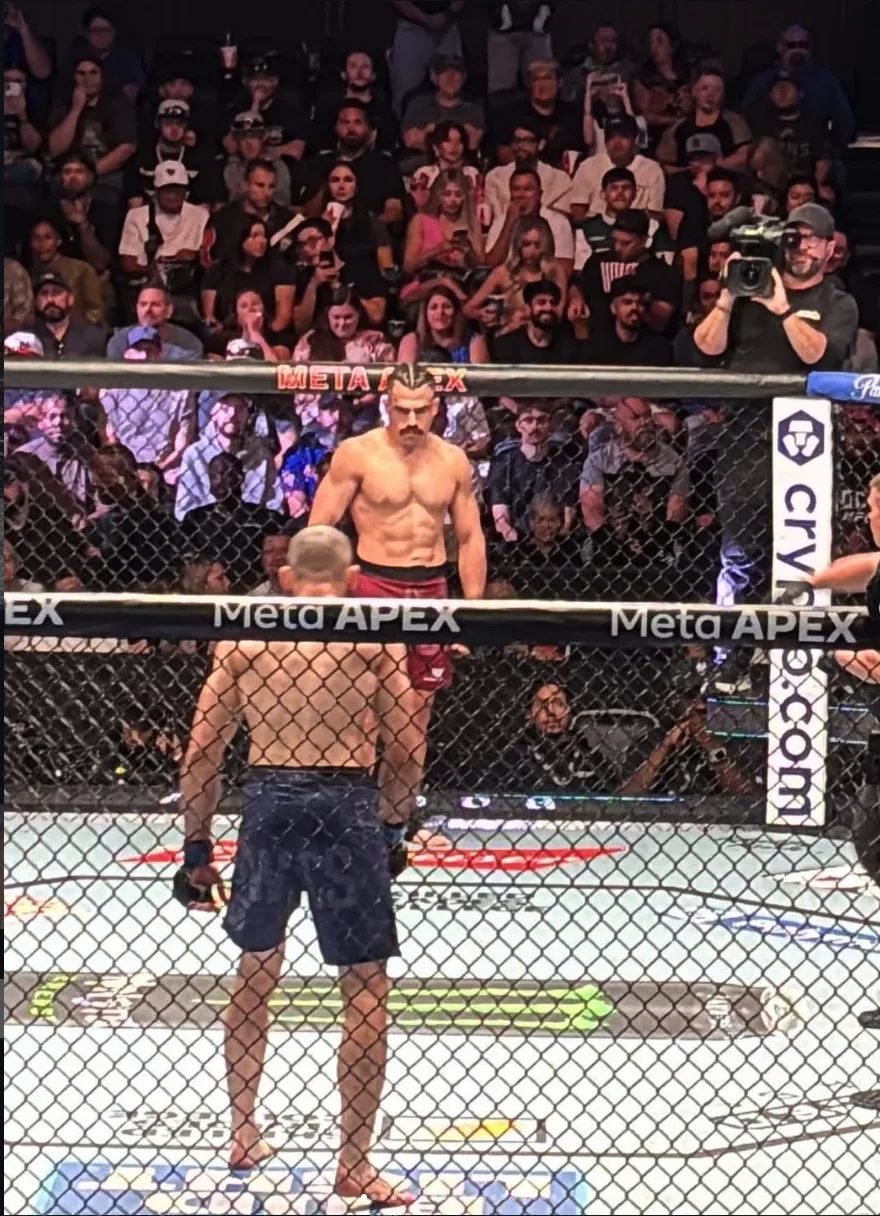 Luis Hernandez staring down Hugo Guillon across the cage at the Meta APEX