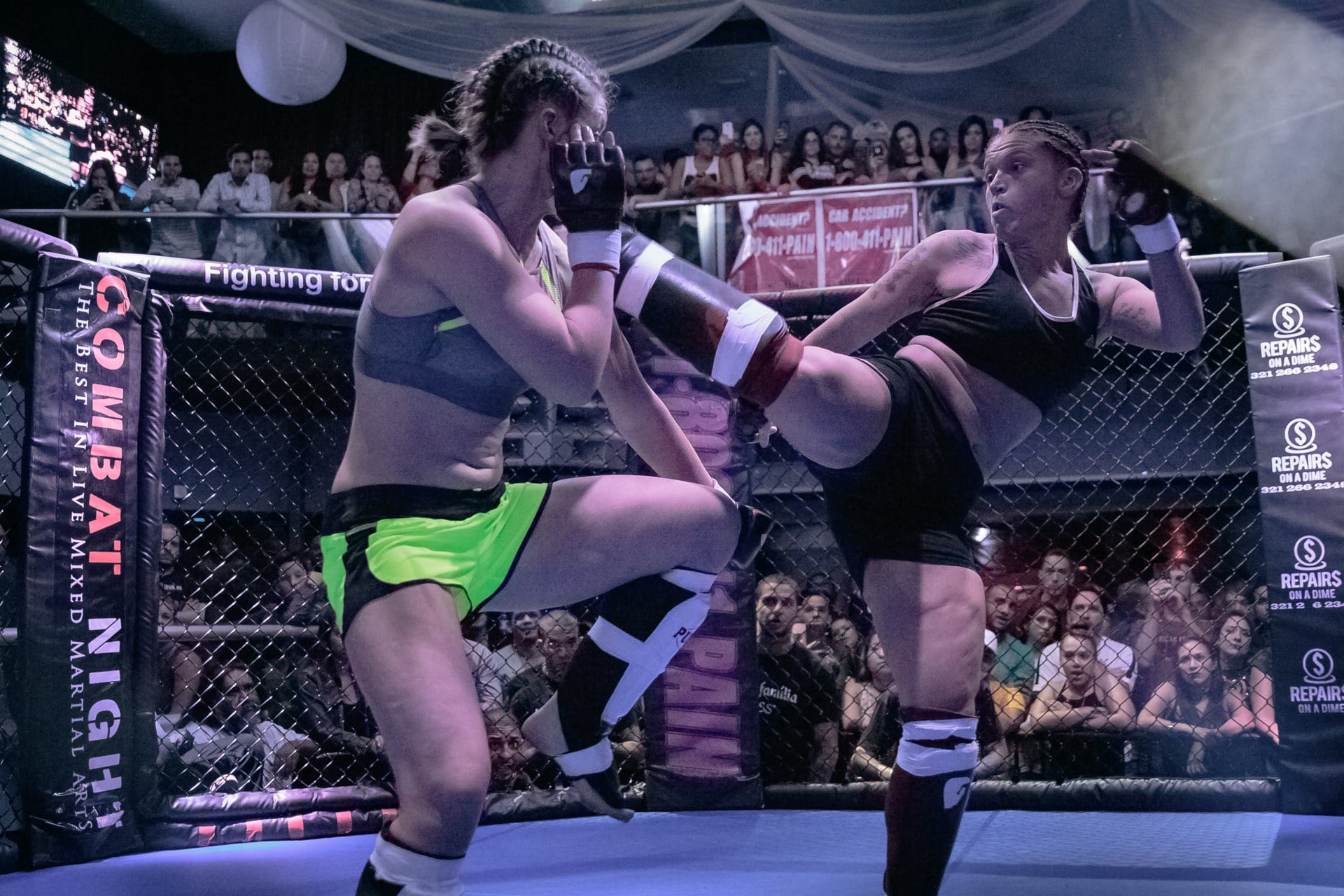 A Combat Night fighter landing a head kick during a live bout
