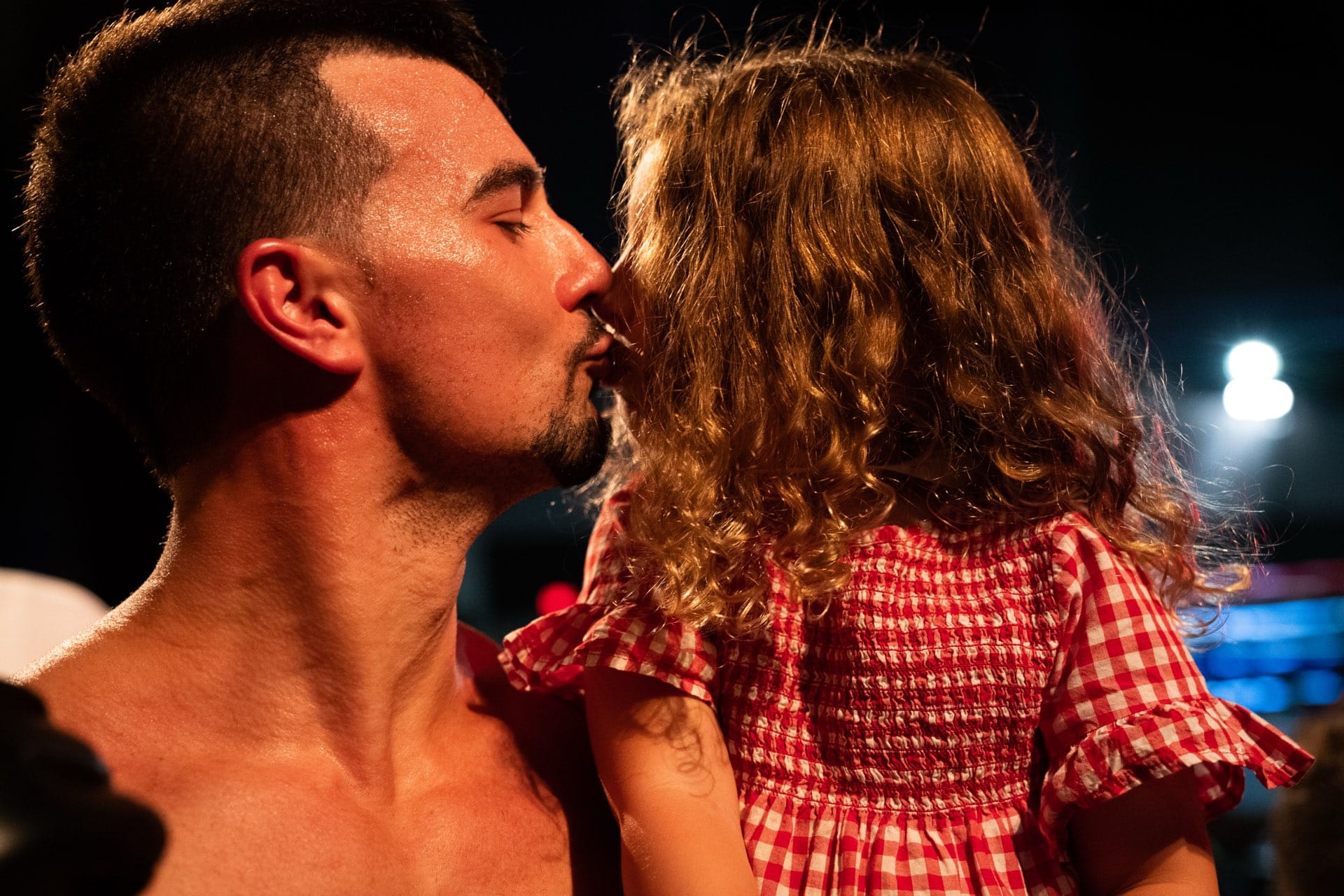 An embrace in the moments after a Combat Night bout.